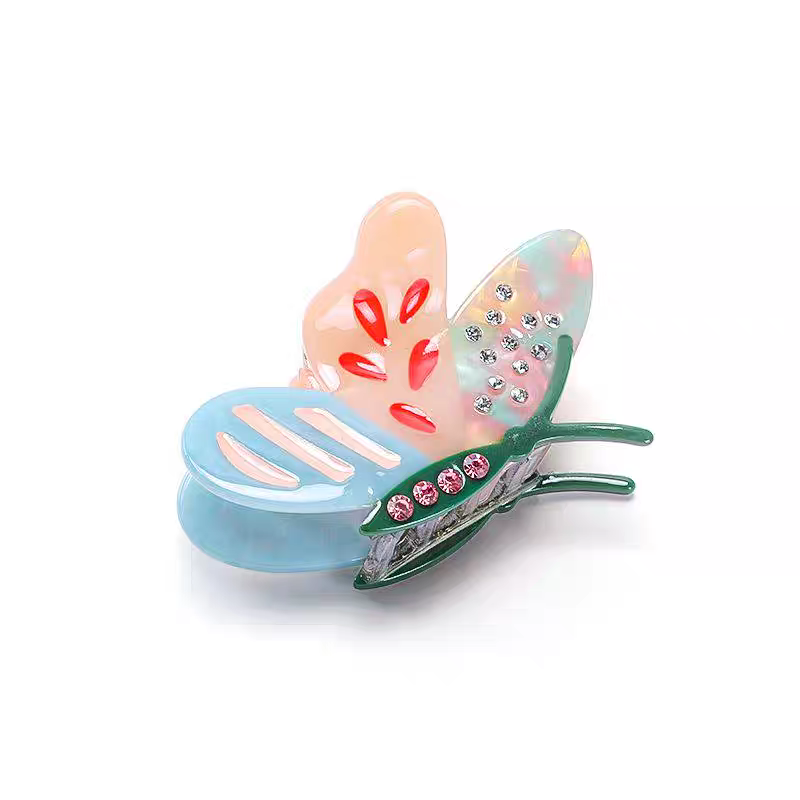 Side Butterfly Hair Claw Clip with colorful pastel wings, inlaid rhinestones, and pink accents.