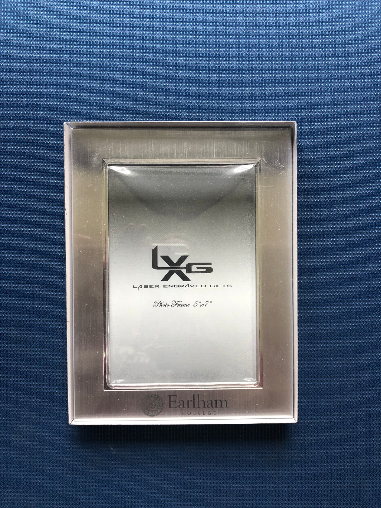 5x7 vertical silver metal picture frame with Earlham College and logo printed below the photo slot.