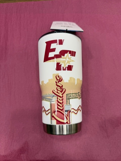 The Campus Tumbler 20oz features a white design with a maroon EC and star logo, city skyline graphic, and "Quakers" in red script. Signs reading Sadler and EC appear near the bottom. Shown on a pink surface.