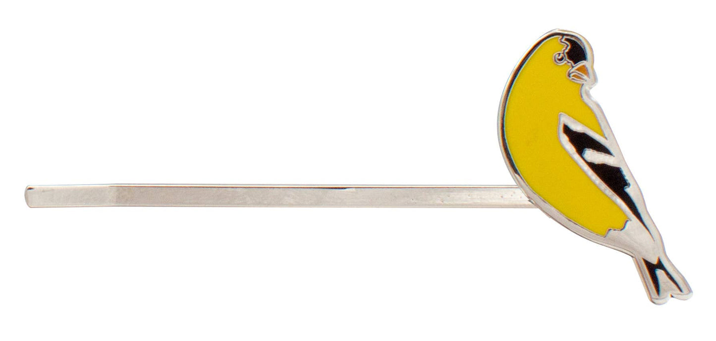 The Songbird Hair Pins feature a silver hairpin adorned with a vibrant yellow and black enamel American Goldfinch perched at one end.