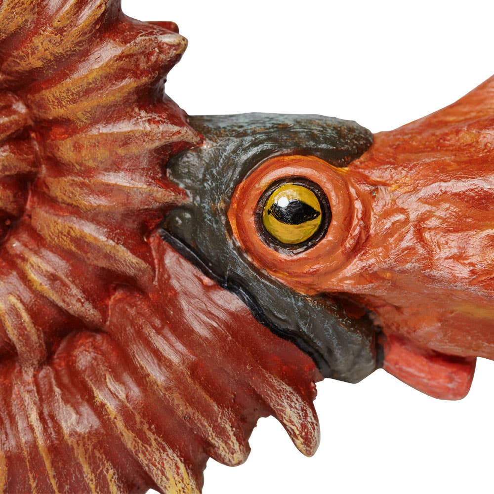 Close-up of a detailed Ammonite Figurine, featuring brown and orange tones, intricate ridges and grooves on its textured surface, reminiscent of the complex patterns seen in real ammonite fossils.