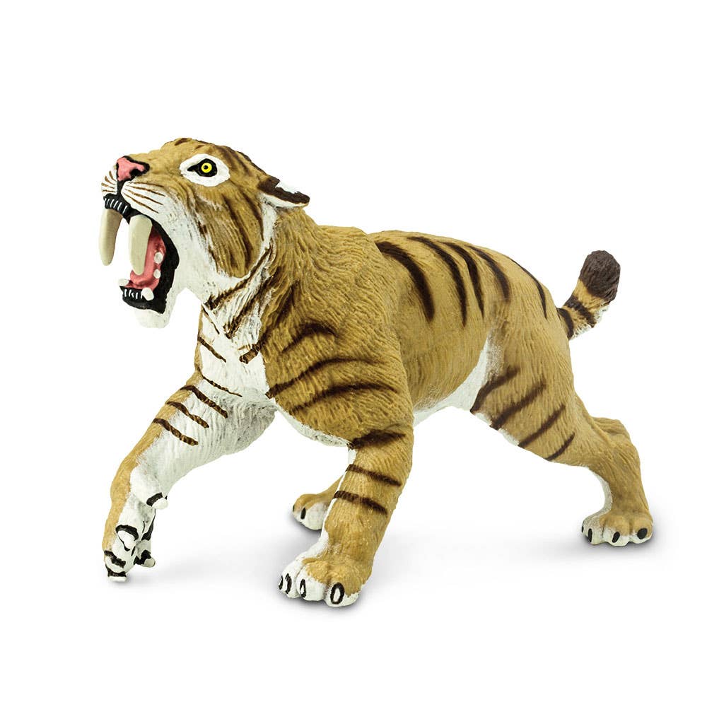 The Smilodon Saber-Toothed Cat Figurine Toy features a model of a saber-toothed cat with its mouth open, displaying large curved fangs, standing on all fours with a detailed striped coat inspired by specimens from the Rancho La Brea tar pits.