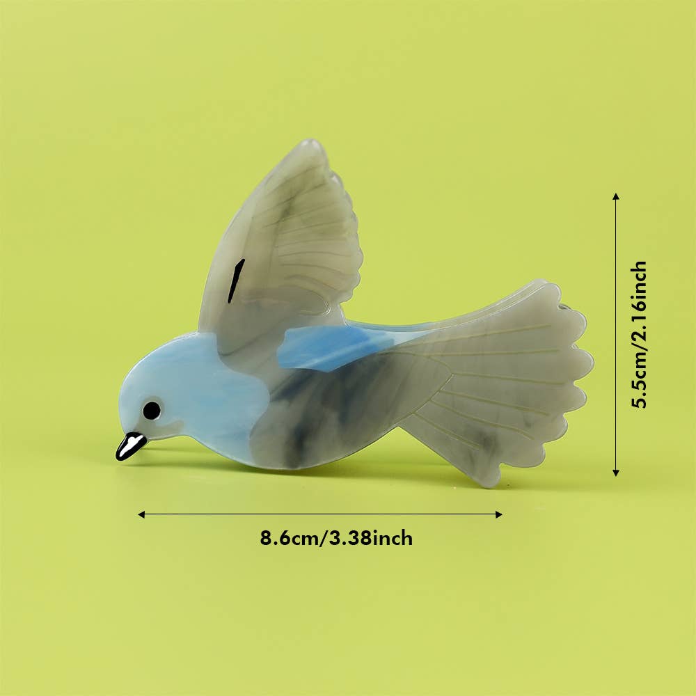 Blue and Gray Bird Hair Claw Clip, a bird-shaped blue acetate hair clip with a gray marbled pattern, measuring 5.5cm/2.16 inches tall and 8.6cm/3.38 inches wide.