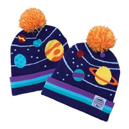 Two Junior Ranger Gear Night Sky Stocking Caps in blue with orange pom-poms feature colorful planet designs and orbit lines, making them the perfect solar system hats for young explorers; each cap is finished with a purple stripe and a Junior Ranger badge on the cuff to complete your junior ranger gear.