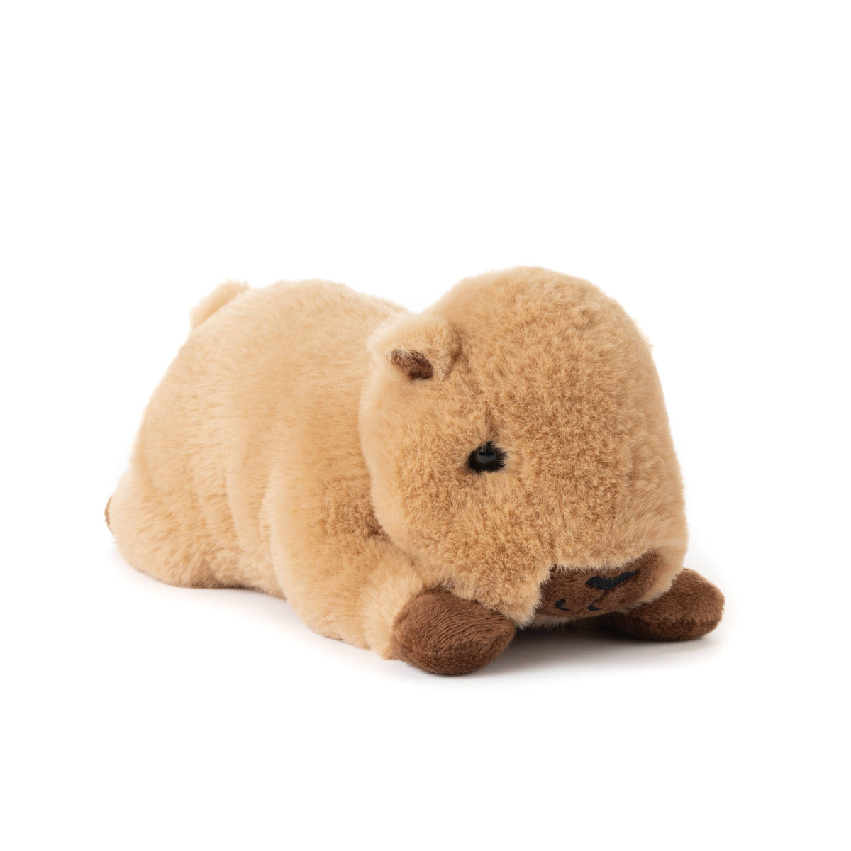 The Scoopz Capybara Small 8″ (21cm) is a soft, light brown plush toy featuring small dark brown feet and a round nose, lying adorably on its stomach—perfect as a stuffed animal for safari nursery decor.