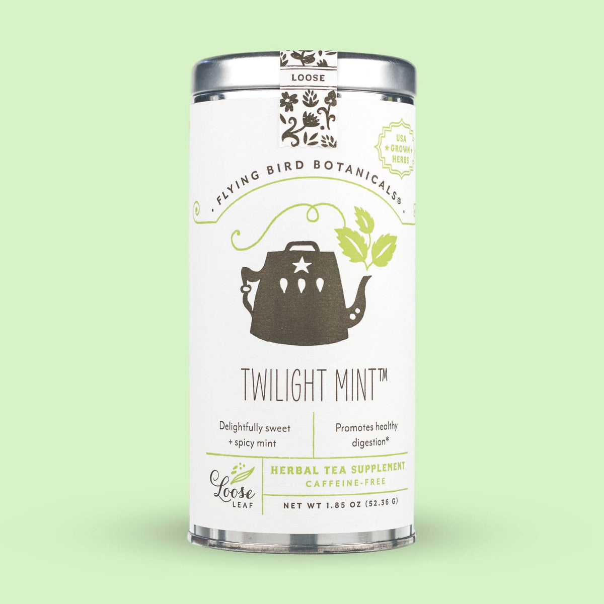 A cylindrical tin of Twilight Mint (ORG) – Loose Leaf Tin featuring a graphic of a teapot with leaves, described as a caffeine-free peppermint tea with a net weight of 1.85 ounces.