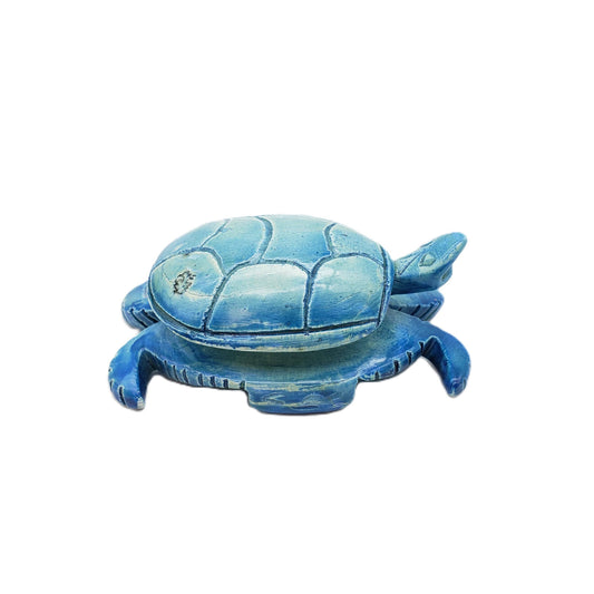 A small, blue soapstone turtle statue—measuring 1.25 inches and made in Egypt—shown on a white background.