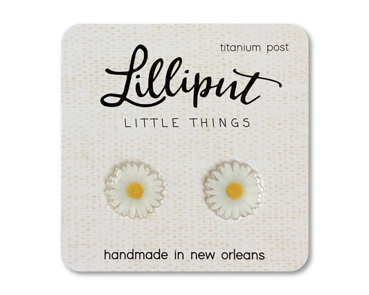 Introducing the Daisy Earrings—a pair of small, daisy-shaped novelty earrings with bright yellow centers and comfortable, hypoallergenic titanium posts. Handmade in New Orleans and presented on a Lilliput Little Things card.
