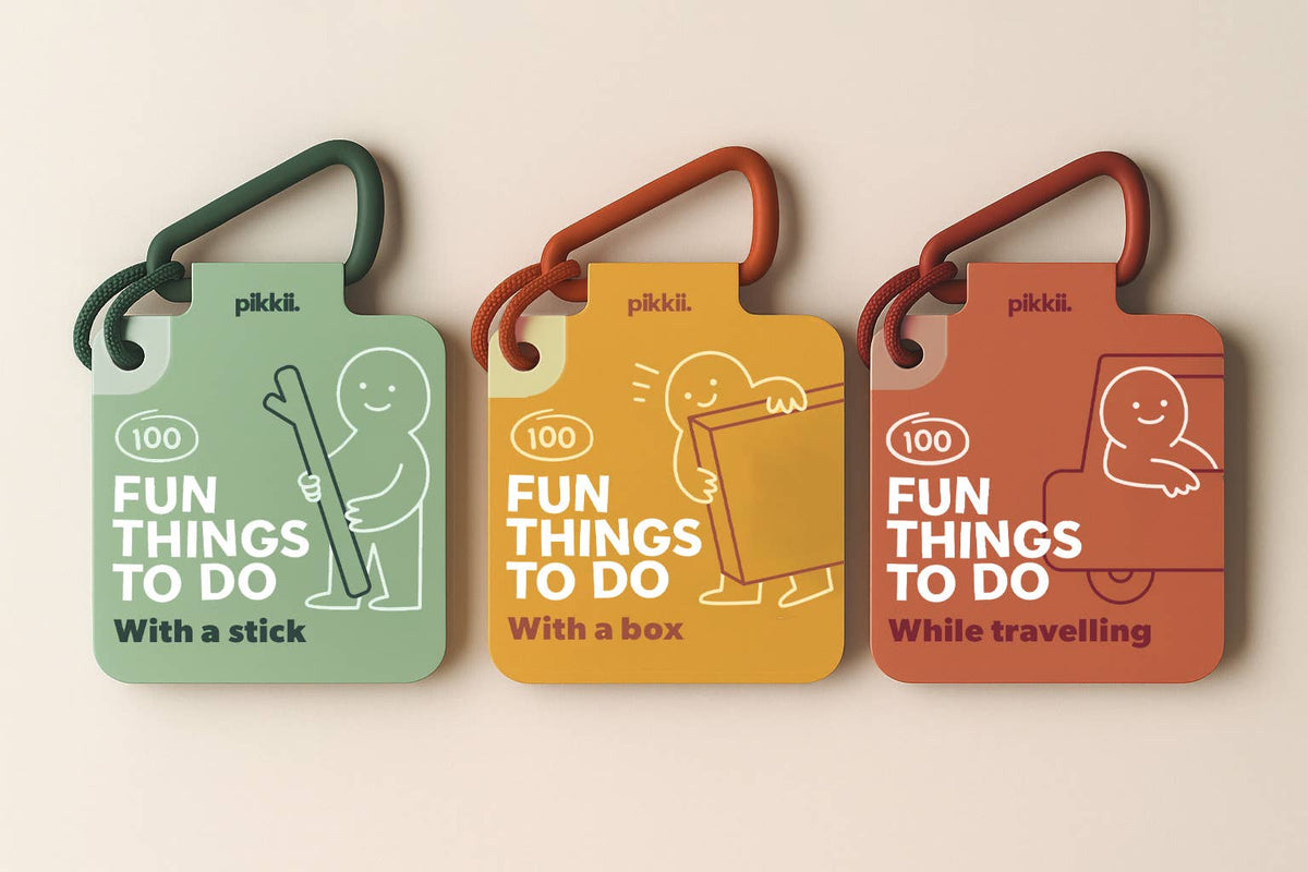 Three sets of 100 Fun Things to do with a stick | Play and Activity Cards attached to carabiners, each featuring a cartoon character to encourage outdoor play while using a stick, a box, or traveling.