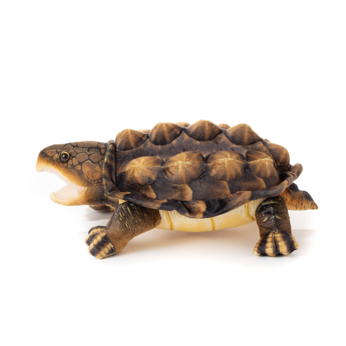 The Wild Onez Snapping Turtle 15″ (38cm) plush features a brown design with a spiked, textured shell and walks to the left on a white background, its mouth open as if making a sound—perfect for adding character to any swamp-themed nursery decor.
