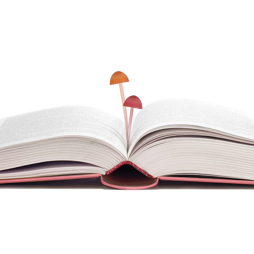 Open book with the mini, mushroom-shaped silicone bookmarks