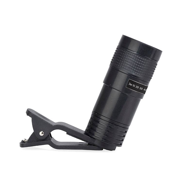 The Phone Telescope is a black clip-on lens with a textured cylindrical body, optical glass for clear images, and an 8x magnification scale, designed to show both the lens and its sturdy clip mechanism.