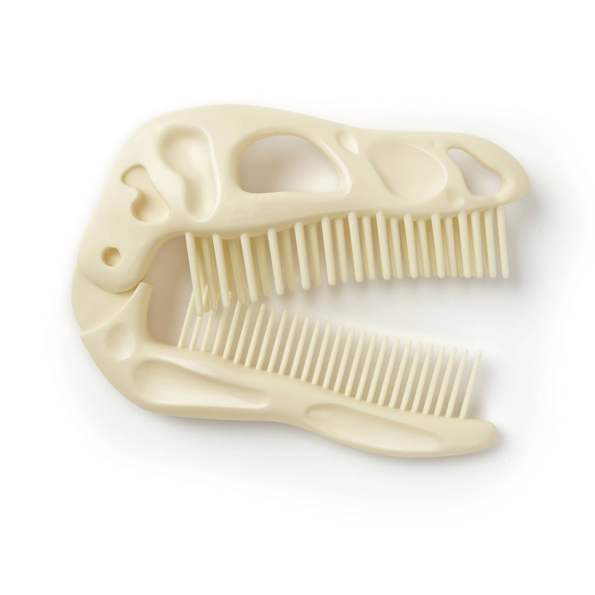 Beige dinosaur-shaped dual comb and brush 