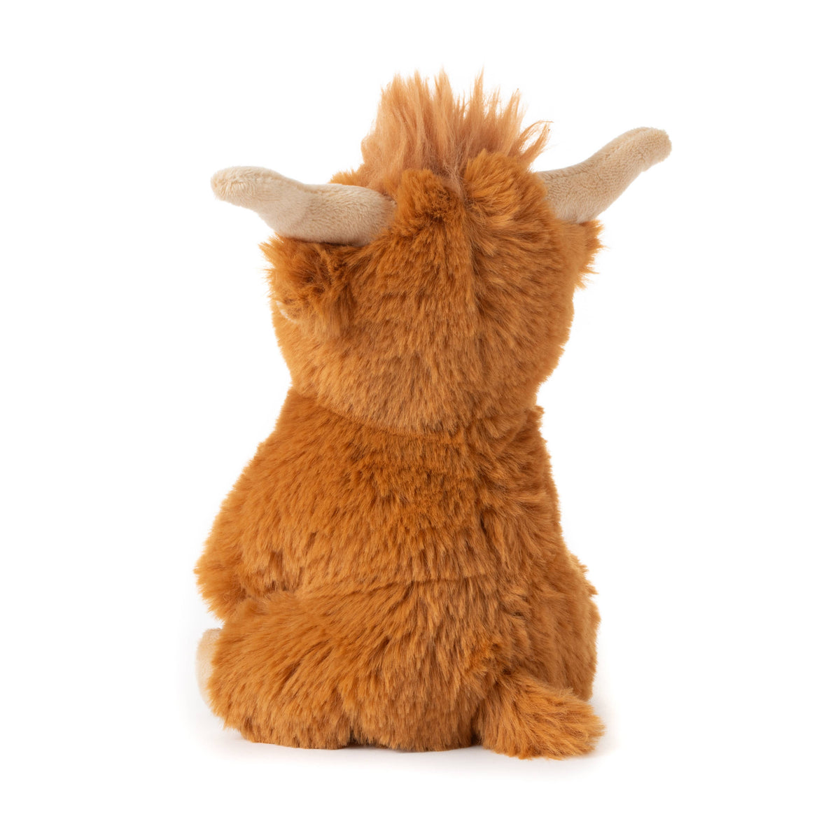 The Wild Onez Highland Cow 6″ (15cm) stuffed animal is shown from behind, displaying its soft, fluffy fur, a small tail, and two beige horns curving outward. This adorable sensory toy sits upright against a white background—perfect for cozy farmhouse nursery decor.
