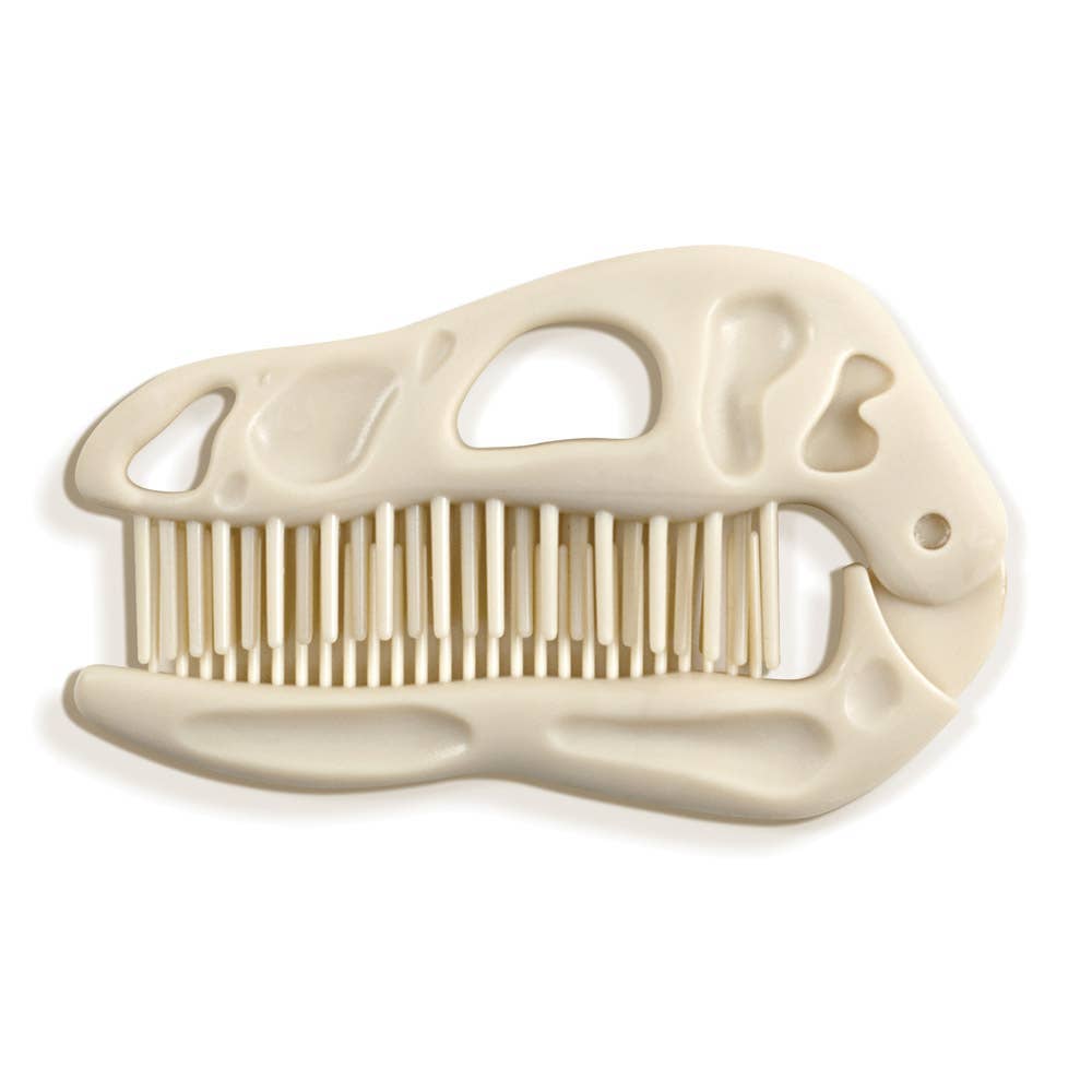 Beige dual comb and brush shaped like a dinosaur skull