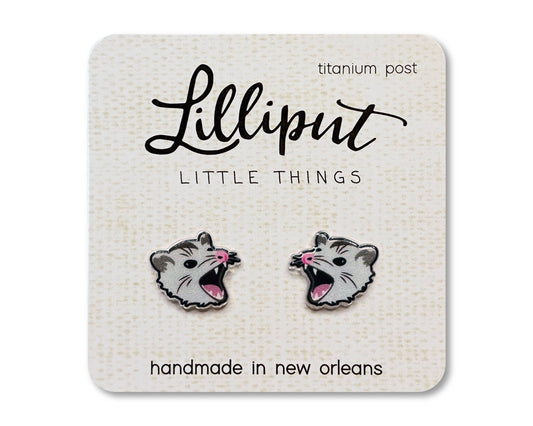 Possum Earrings featuring opossum heads with open mouths, displayed on a Lilliput Little Things card. These hypoallergenic titanium earrings are handmade in New Orleans.