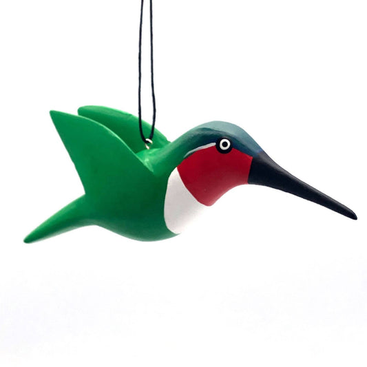 The Ruby Throated Hummingbird Balsa Ornament features hand-carved balsa wood with green wings, a red throat, and white chest. Hanging by a black string, it's an enchanting addition to your Christmas ornament collection.