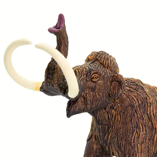 A close-up of the Woolly Mammoth toy figure, featuring richly textured brown fur, curled white tusks, and a raised trunk that captures the majestic essence of this iconic Ice Age prehistoric animal.