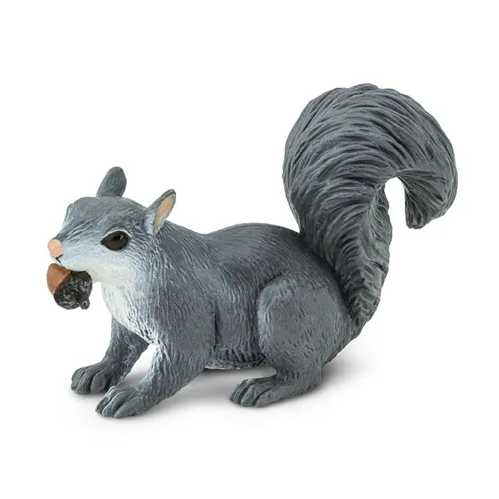 The Gray Squirrel Figure is depicted in a crouched position with its bushy tail curved upwards and a brown acorn in its mouth, set against a plain white background.