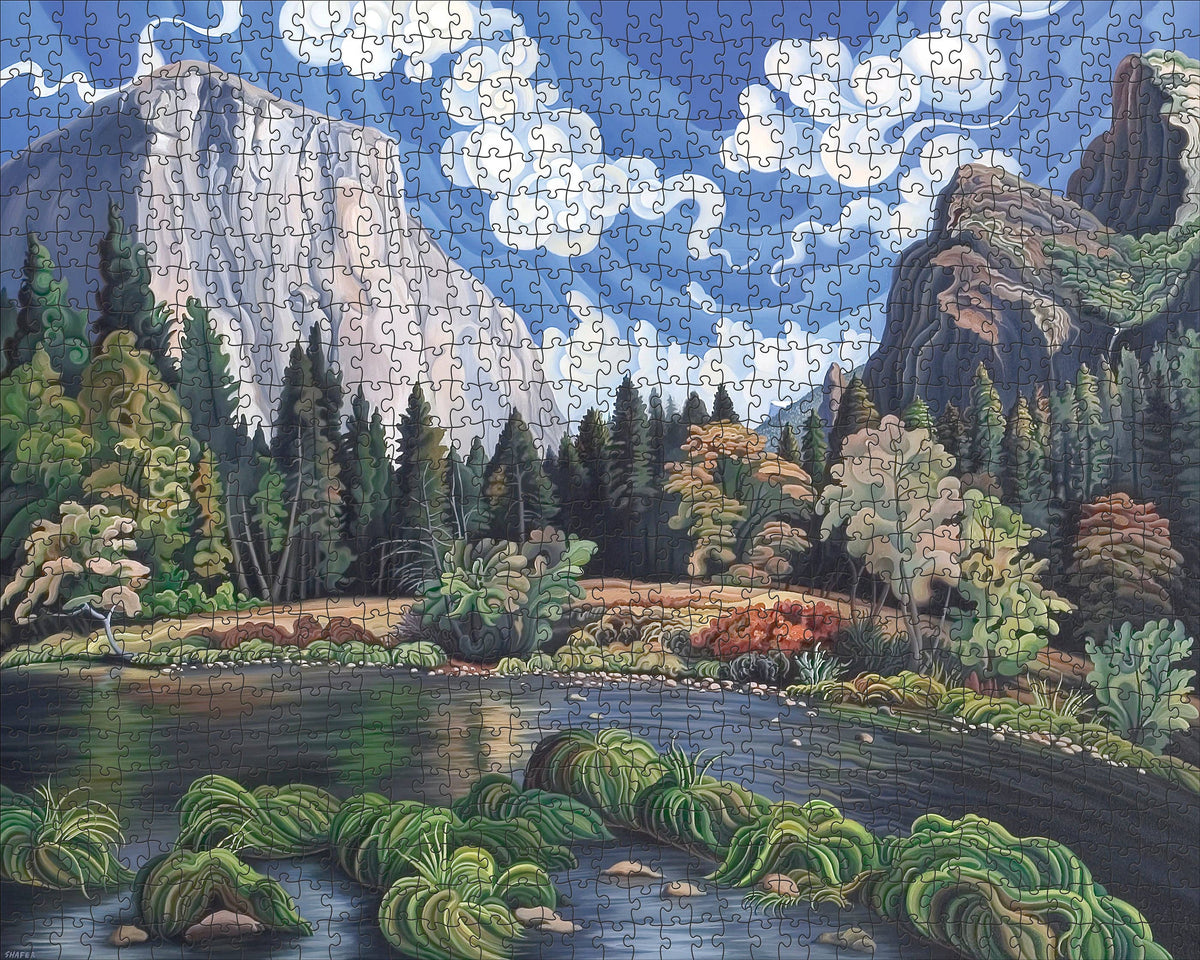 A Phyllis Shafer: Autumn in Yosemite Valley 1000pc jigsaw puzzle featuring a landscape with a winding river, forest, and a prominent granite cliff under a blue, cloudy sky.