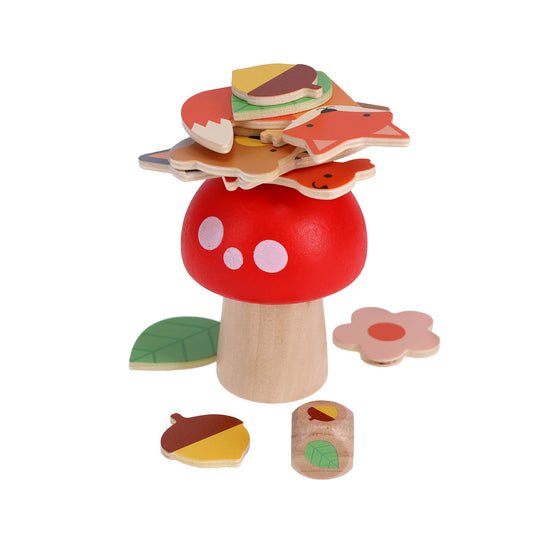Woodland Wobble: A Wildlife Stacking Game features a wooden toy mushroom with a red top and white spots, plus colorful wooden shapes like leaves, acorns, and flowers—encouraging fine motor skills on a crisp white background.
