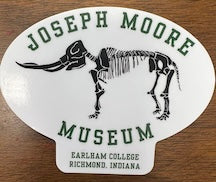 The JMM Mastodon Sticker is a unique 3x3 inch oval die-cut sticker featuring a mastodon skeleton, with "Joseph Moore Museum" and "Earlham College, Richmond, Indiana" written around and below the image on a white background—perfect for museum enthusiasts and collectors alike.