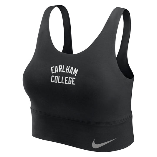 Sure! Here’s the rewritten sentence using your product data: The Nike Sports Bra is black with “Earlham College” displayed in bold white capital letters across the front and a gray Nike swoosh logo on the lower left band. Designed with wide shoulder straps and a racerback style for comfort and support.