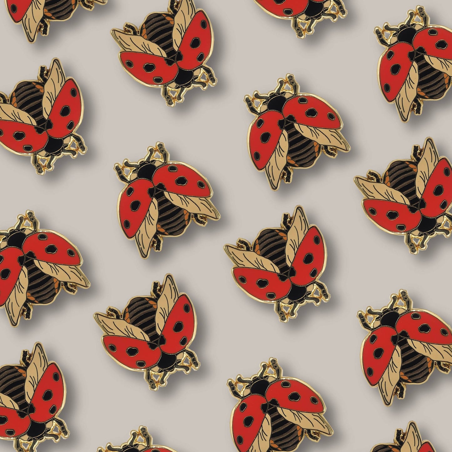 Here’s a rewritten sentence using your product data: A repeating pattern of Seven-Spotted Ladybug Educational Insect Enamel Pins on a neutral background. Each pin features a red ladybug with black spots, gold accents, and is designed as both an accessory and an educational piece.