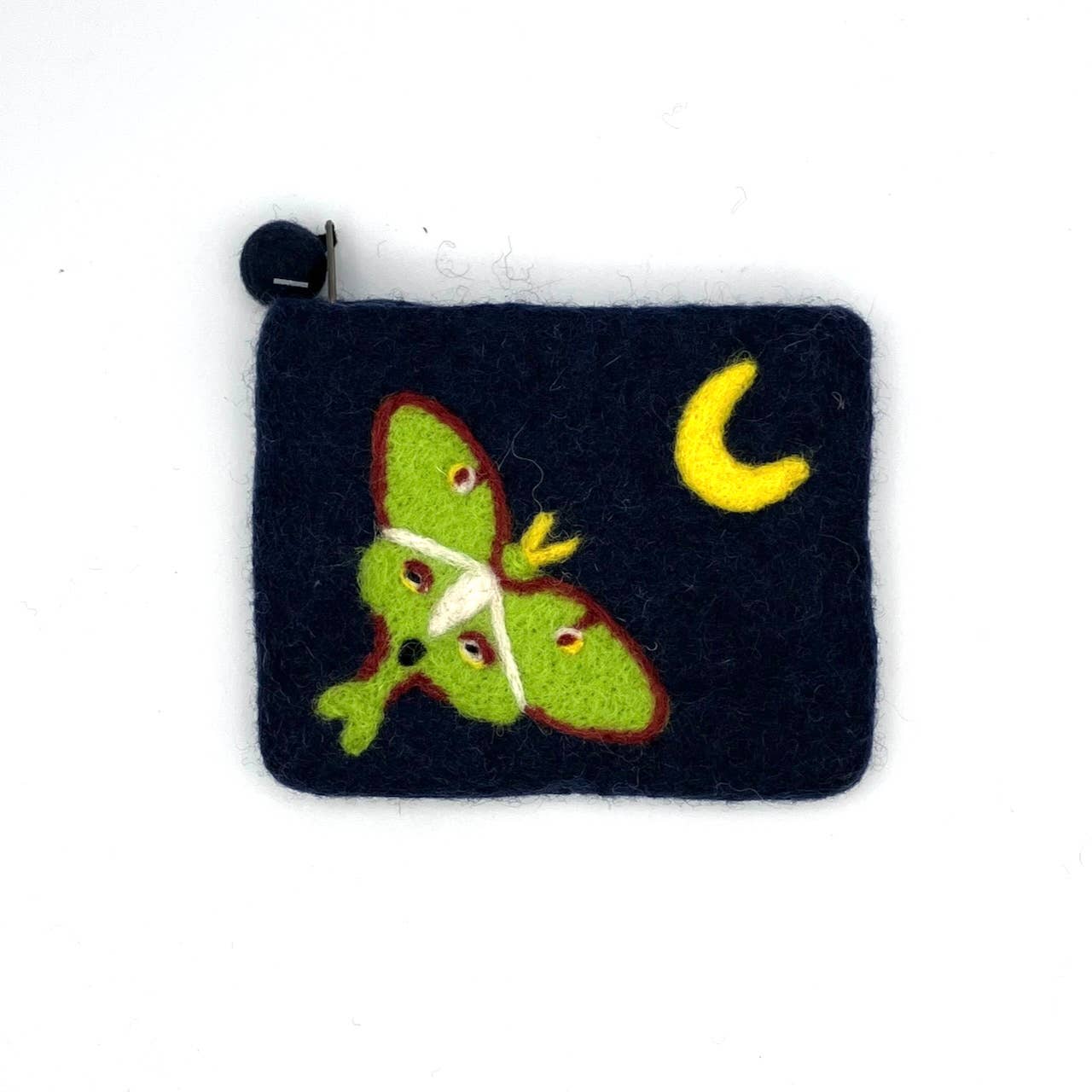 The Luna Moth Felt Coin Purse is a small, handcrafted dark blue pouch made by artisan Nepal in the spirit of fair trade, featuring a green moth and yellow crescent moon design. It closes with a black button located at the top left corner.