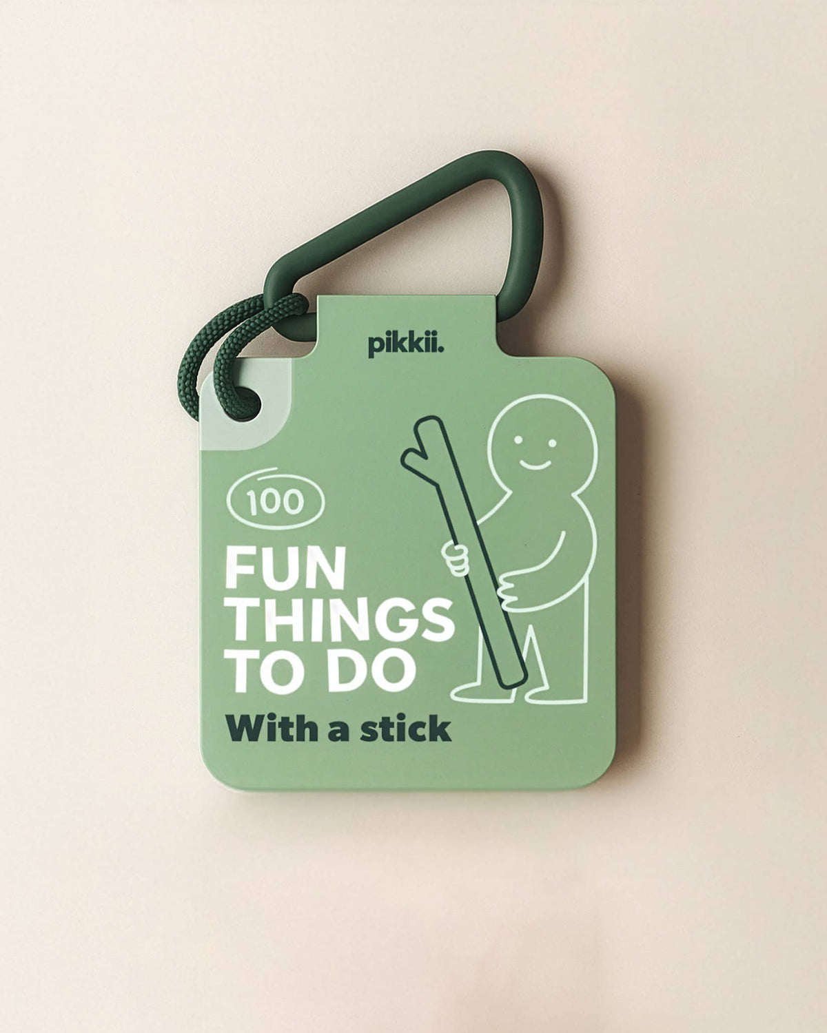 Fun Things to do with a stick | Play and Activity Cards featured on a green carabiner, illustrated with a cartoon figure holding a large stick to offer screen-free outdoor play ideas.