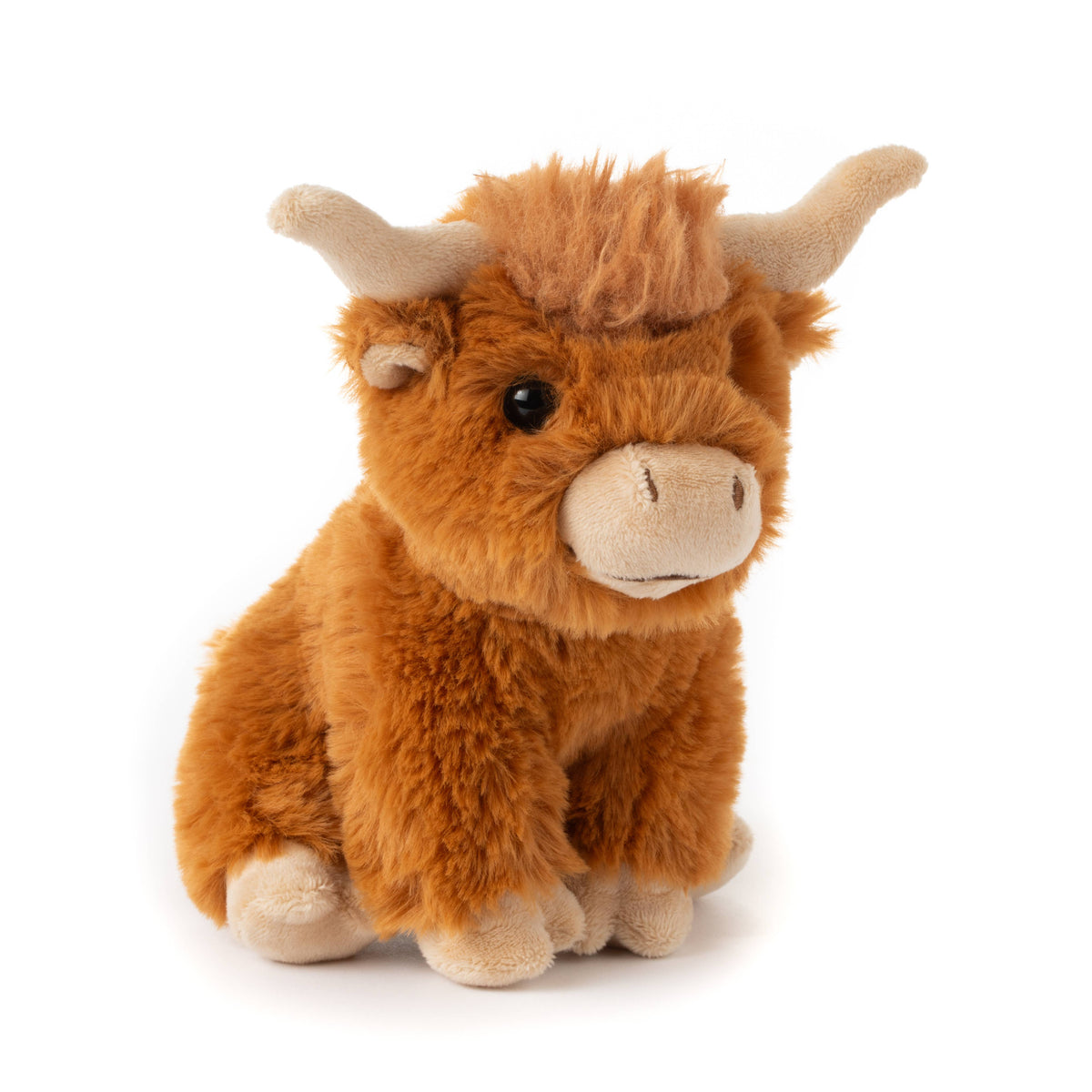 The Wild Onez Highland Cow 6″ (15cm) features soft orange-brown fur, beige horns, and a beige snout, sitting upright against a white background—making it perfect as charming farmhouse nursery decor.