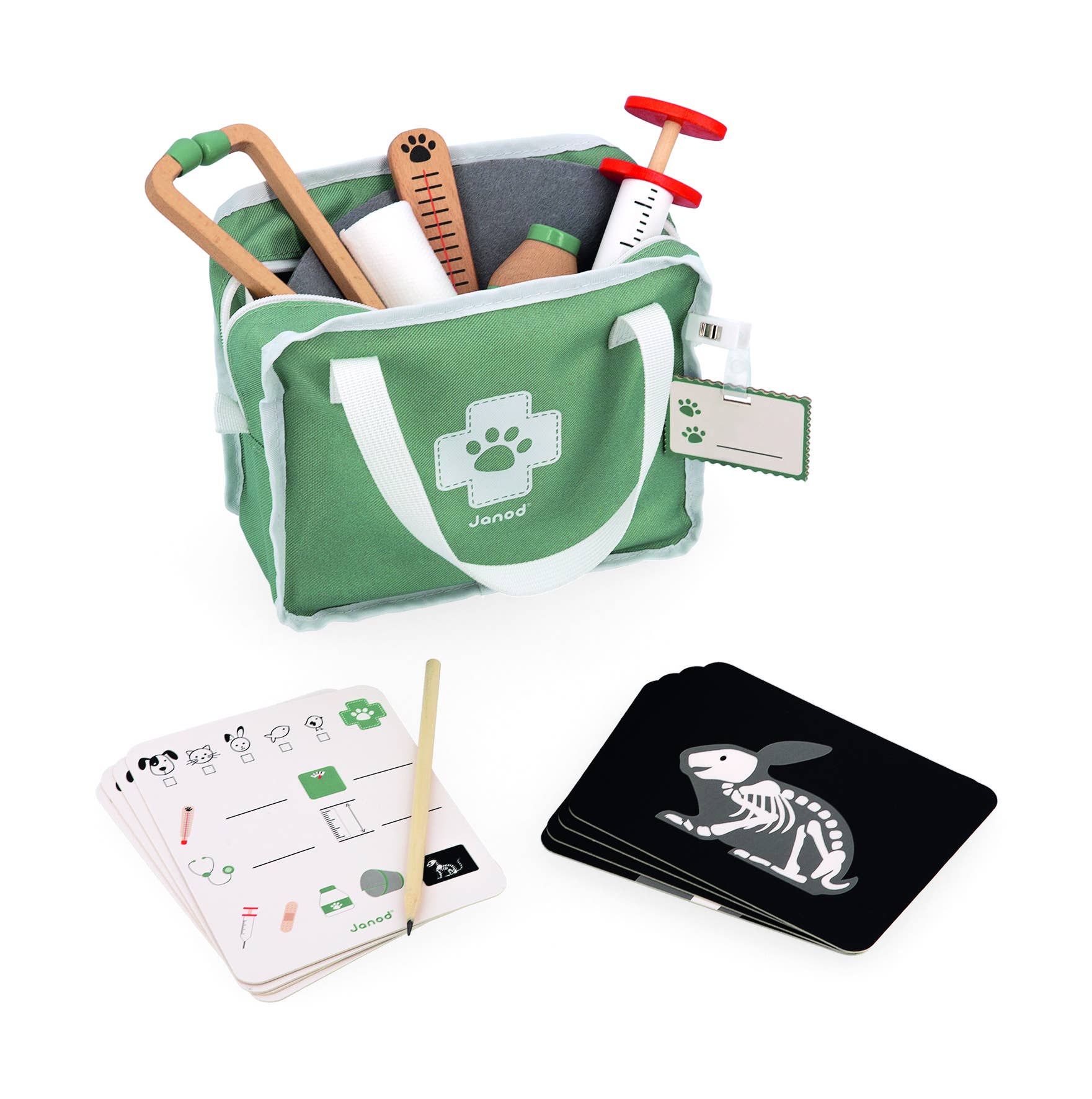 The Pretend Play Occupational Toy Vet Set with 15 accessories features a green kit with a white cross, wooden medical tools, illustrated activity cards, X-ray rabbit cards, and a pencil placed on one of the cards.