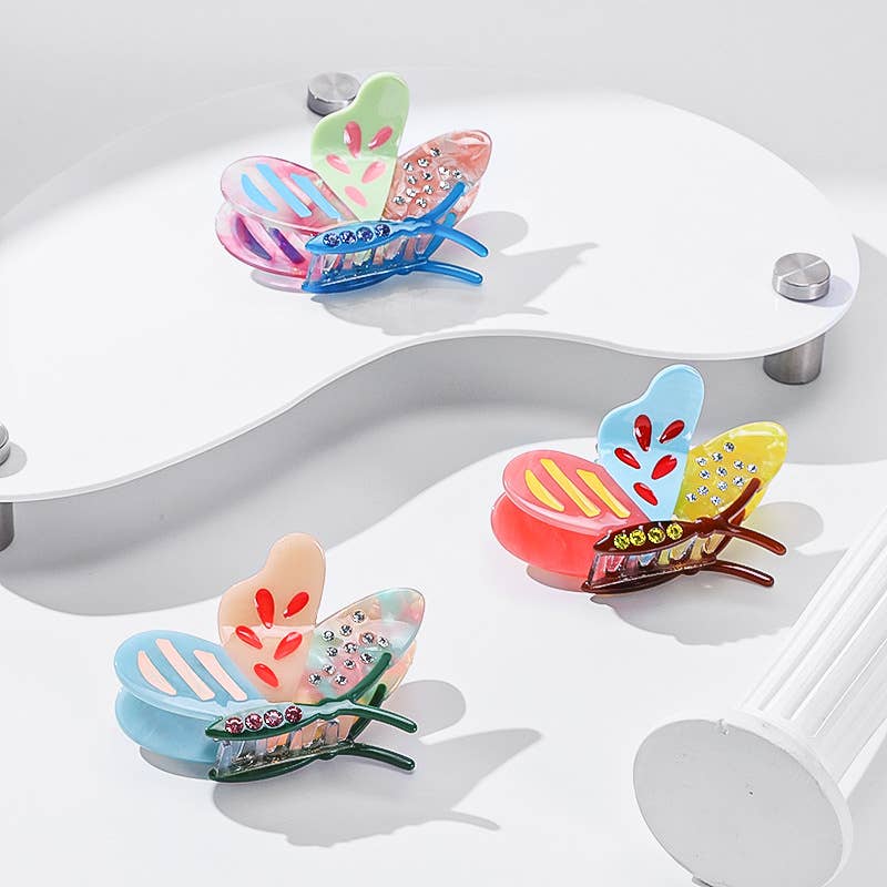 Three colorful, patterned translucent Side Butterfly Hair Claw Clips.