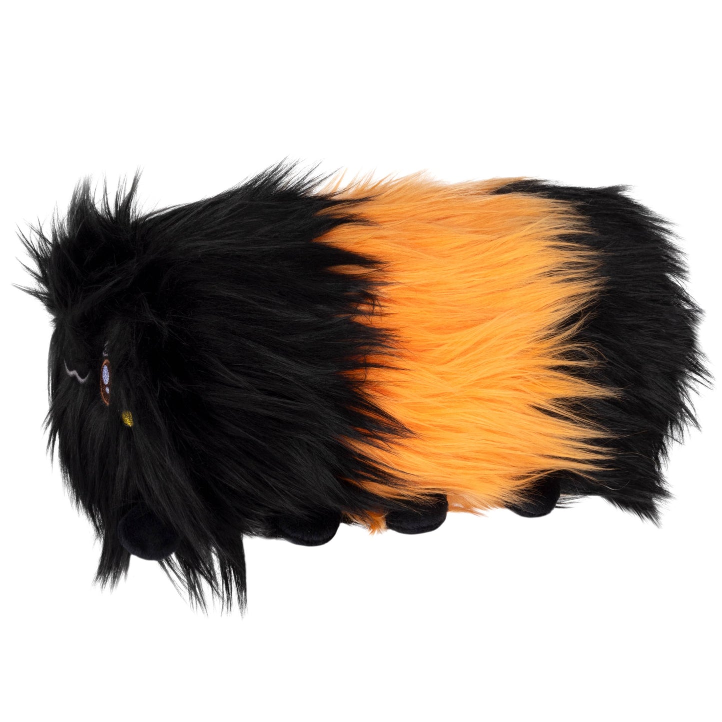The Mini Squishable Woolly Caterpillar is a plush toy with brown segments, long black and orange fur, tiny black legs, and embroidered eyes—just like the caterpillars famous for predicting winter weather.