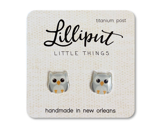Introducing our Owl Earrings—a charming pair of novelty earrings shaped like owls, beautifully displayed on a card labeled “Lilliput Little Things.” Crafted by hand in New Orleans with titanium posts, these hypoallergenic earrings are perfect for sensitive ears and add a whimsical touch to any outfit.