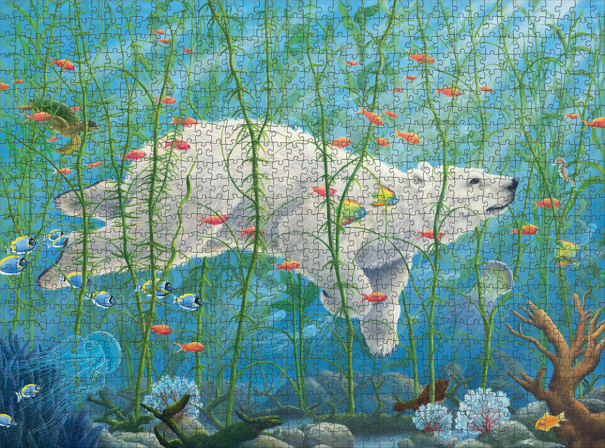 A Robert Bissell: The Buffalo 1000pc jigsaw puzzle depicting a white polar bear swimming underwater through a forest of tall green kelp, surrounded by various colorful tropical fish and a sea turtle.