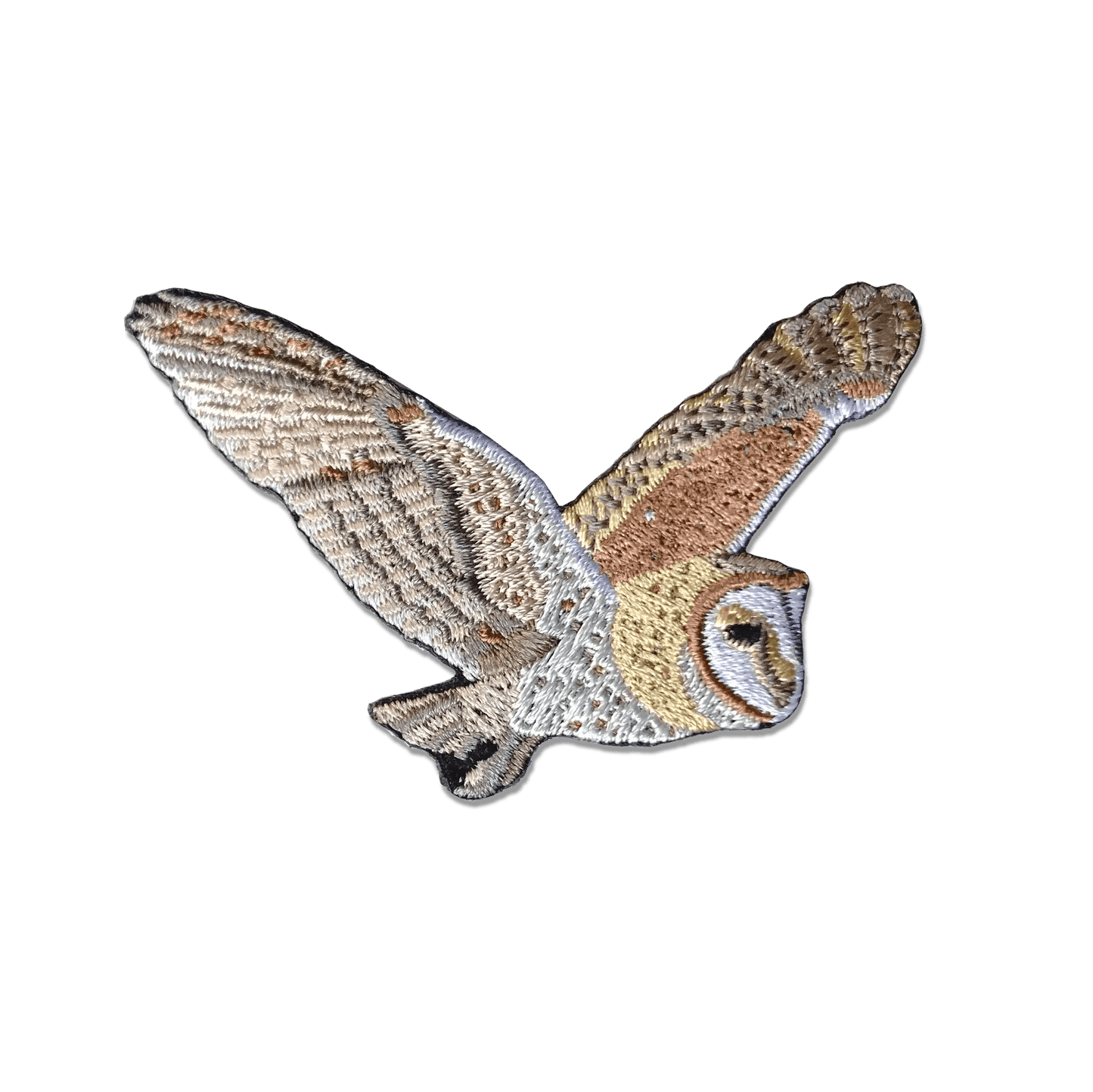 The Barn Owl Patch features an embroidered barn owl in flight with outstretched wings and detailed brown, tan, white, and black stitching on a plain white background. Ideal as an iron-on patch for personalizing your favorite items.