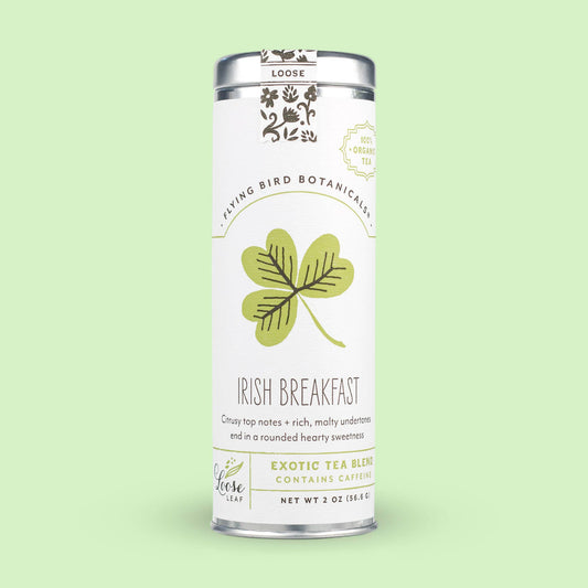 Cylindrical Irish Breakfast (ORG) – Loose Leaf Tin featuring a green clover illustration and text describing the tea blend.