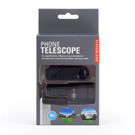 The boxed Phone Telescope by Kikkerland offers 8x magnification and optical glass. The packaging shows usage illustrations and highlights its universal fit for any smartphone.