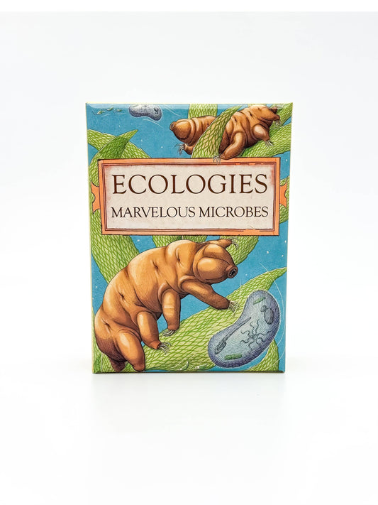 The game box for Ecologies: Marvelous Microbes displays captivating artwork of tardigrades, green leaves, and a blue microbe against a light background, perfectly reflecting the scientific card game’s focus on microscopic food webs and the wonders of biology.