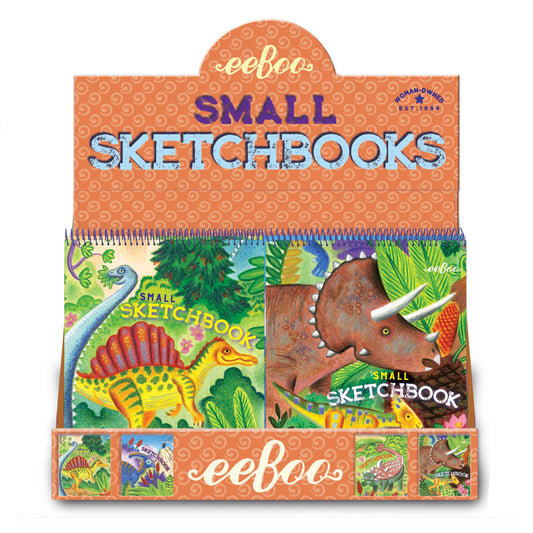 The Small Sketchbooks Dino Assortment display box by eeBoo features colorful dinosaur illustrations, including Stegosaurus and Triceratops, in vibrant orange packaging with decorative patterns.