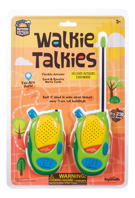The Outdoor Discovery Walkie Talkies, for ages 5+, include two green and yellow devices with flexible antennas, volume control, 250-foot range, and Morse Code. Packaging includes a choking hazard warning.